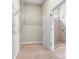 Walk-in closet with wire shelving, plush carpet, and doorway leading to a bathroom at 7850 Fountaingrass Ln, Sherrills Ford, NC 28673