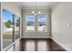 Bright dining area with sliding door access to the patio and windows offering backyard views at 7850 Fountaingrass Ln, Sherrills Ford, NC 28673