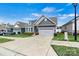 Single Gathering home boasting a well-manicured lawn, classic curb appeal, and a spacious driveway at 7850 Fountaingrass Ln, Sherrills Ford, NC 28673