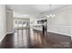 Spacious open concept home features an island kitchen, dark wood floors, and plenty of natural light at 7850 Fountaingrass Ln, Sherrills Ford, NC 28673