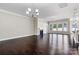 Spacious living room featuring gleaming hardwood floors, a cozy fireplace, and ample natural light at 7850 Fountaingrass Ln, Sherrills Ford, NC 28673