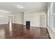 Expansive living room with a fireplace, shiny hardwood floors, and an open layout design at 7850 Fountaingrass Ln, Sherrills Ford, NC 28673