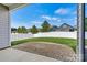 Covered patio with brick pavers overlooking a fenced-in backyard and green lawn at 7850 Fountaingrass Ln, Sherrills Ford, NC 28673