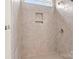 Tile shower with built-in niche, glass door, and modern fixtures at 7850 Fountaingrass Ln, Sherrills Ford, NC 28673