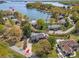 Stunning aerial view of a waterfront property with mature trees, private boat slip, and neighborhood pool at 7980 Bradford Ln, Denver, NC 28037