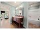 Bathroom features a classic vanity and a shower/tub combination, offering both style and functionality at 7980 Bradford Ln, Denver, NC 28037