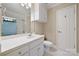 Bright bathroom with white cabinets, tile flooring, and great natural lighting at 7980 Bradford Ln, Denver, NC 28037