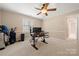 Bedroom with neutral walls, carpet flooring, a ceiling fan, and natural light at 7980 Bradford Ln, Denver, NC 28037