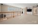 Bright bonus room with built-in shelving and great natural light from the window at 7980 Bradford Ln, Denver, NC 28037