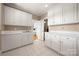 Spacious butler's pantry featuring bright white cabinetry and plenty of storage at 7980 Bradford Ln, Denver, NC 28037