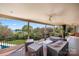 Enjoy the home's covered deck with views of lush lawn and a peaceful lake at 7980 Bradford Ln, Denver, NC 28037