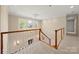 Hallway view with decorative chandelier and staircase, providing great natural light at 7980 Bradford Ln, Denver, NC 28037