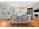 Kitchen with white cabinets, stainless steel appliances, a skylight, and a breakfast bar at 7980 Bradford Ln, Denver, NC 28037