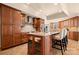 The kitchen features custom wood cabinets and a sizable island with barstool seating at 7980 Bradford Ln, Denver, NC 28037