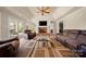 Sunroom with large windows and access to outdoor seating area, perfect for relaxation at 7980 Bradford Ln, Denver, NC 28037