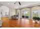 Spacious living room with hardwood floors, arched doorways, and a view of the water at 7980 Bradford Ln, Denver, NC 28037
