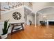 Spacious living area featuring hardwood floors, grand arches, and inviting natural light at 7980 Bradford Ln, Denver, NC 28037