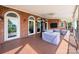 Covered outdoor patio featuring brick accents, ceiling fans, and an amazing view at 7980 Bradford Ln, Denver, NC 28037