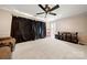 Home theater room featuring neutral carpeting, ceiling fan, and great space at 7980 Bradford Ln, Denver, NC 28037