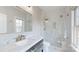 This stylish bathroom features marble countertops, dual sinks, and a glass-enclosed shower at 819 Beauhaven Ln, Waxhaw, NC 28173