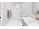 Modern bathroom with marble countertop, vanity, shower and tub combination, and sleek fixtures at 819 Beauhaven Ln, Waxhaw, NC 28173