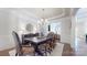 Elegant dining room featuring a large table, detailed chairs, and decorative mirror at 819 Beauhaven Ln, Waxhaw, NC 28173