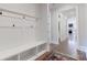 Mud room hallway featuring a bench and storage cubbies leading to the living room at 819 Beauhaven Ln, Waxhaw, NC 28173