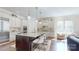 Stylish kitchen with a large island, stainless steel appliances, granite countertops, and barstool seating at 819 Beauhaven Ln, Waxhaw, NC 28173
