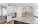 Bright kitchen with an island, granite countertops, stainless steel appliances, and custom cabinetry at 819 Beauhaven Ln, Waxhaw, NC 28173