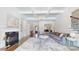 Spacious living room with hardwood floors, fireplace, and a large sectional sofa for comfortable living at 819 Beauhaven Ln, Waxhaw, NC 28173