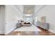 Bright primary bedroom with tray ceilings, chandelier, large windows and hardwood floors at 819 Beauhaven Ln, Waxhaw, NC 28173