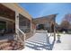 Covered brick patio with a wooden pergola and an outdoor kitchen and bar area at 819 Beauhaven Ln, Waxhaw, NC 28173