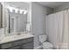 Bathroom features a single sink vanity with a shower/tub combo at 8311 Camberly Rd, Huntersville, NC 28078