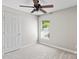 Empty bedroom features neutral walls and carpet, a window, and a door at 8311 Camberly Rd, Huntersville, NC 28078
