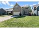 Charming two-story home with well-maintained lawn and attached garage at 8311 Camberly Rd, Huntersville, NC 28078