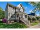 Charming home featuring a well-manicured lawn and welcoming front porch with stylish white railings at 8311 Camberly Rd, Huntersville, NC 28078