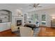 Cozy living room featuring a fireplace, built-in shelves, hardwood floors, and a comfortable seating arrangement at 8311 Camberly Rd, Huntersville, NC 28078
