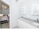Bathroom features a dual sink vanity, granite countertop, and an adjoining bedroom at 8718 Canter Post Dr, Charlotte, NC 28216