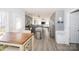 Modern kitchen with gray cabinetry, stainless steel appliances, an island, and an adjacent dining area, perfect for gatherings at 8718 Canter Post Dr, Charlotte, NC 28216