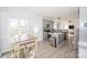 Open concept kitchen with gray cabinets, stainless appliances, and an island with breakfast bar at 8718 Canter Post Dr, Charlotte, NC 28216