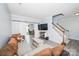 Cozy living room showcasing a sectional sofa, a modern coffee table, and a staircase leading to the upper level at 8718 Canter Post Dr, Charlotte, NC 28216