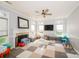 Spacious living room features a fireplace, lots of natural light, and playroom floor at 8718 Canter Post Dr, Charlotte, NC 28216