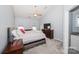 Comfortable main bedroom with vaulted ceiling, large bed, and dresser at 8718 Canter Post Dr, Charlotte, NC 28216