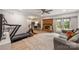 Finished basement area complete with fireplace, home gym, and sliding doors to the outside at 9025 Shields Dr, Huntersville, NC 28078