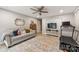 Finished basement with a comfortable seating area, home gym, and neutral-toned walls and flooring at 9025 Shields Dr, Huntersville, NC 28078