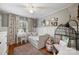 Charming bedroom with a full-size bed, hardwood floors, natural light, and unique decorative accents at 9025 Shields Dr, Huntersville, NC 28078