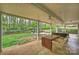 Relaxing covered patio with outdoor dining and seating, perfect for entertaining at 9025 Shields Dr, Huntersville, NC 28078
