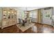 Inviting dining room with hardwood floors, a rustic hutch, and a light-filled window at 9025 Shields Dr, Huntersville, NC 28078