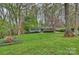 Charming one-story home with a well-manicured lawn and mature trees at 9025 Shields Dr, Huntersville, NC 28078