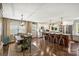 Modern kitchen and dining area with stainless steel appliances, a large island, and an open floor plan at 9025 Shields Dr, Huntersville, NC 28078